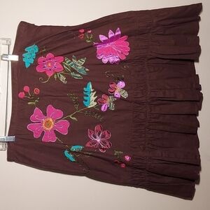 Bandelino flower embroidered dress with ruffles.